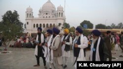 Indian Sikh pilgrims visit Gurdwara Darbar Sahib, the shrine of spiritual leader Guru Nanak Dev, in Kartarpur, Pakistan.