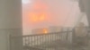 Fire burns in  in the aftermath of air strikes at Kuwait International Airport in Kuwait City on June 3.