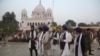 FILE: Indian Sikh pilgrims visit Gurdwara Darbar Sahib, the shrine of their spiritual leader Guru Nanak Dev in Kartarpur.