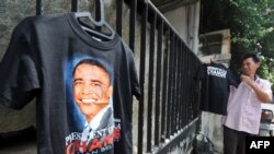 A man sells T-shirts picturing U.S. President Barack Obama outside a primary school in Jakarta, Indonesia.