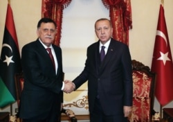 Глава ПНС Фаиз Сарадж (слева) в Анкаре в гостях у президента Турции Реджепа Эрдогана. 15 декабря 2019 года
