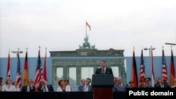 U.S. President Ronald Reagan speaks in front of the Brandenburg Gate and the Berlin Wall on June 12, 1987.