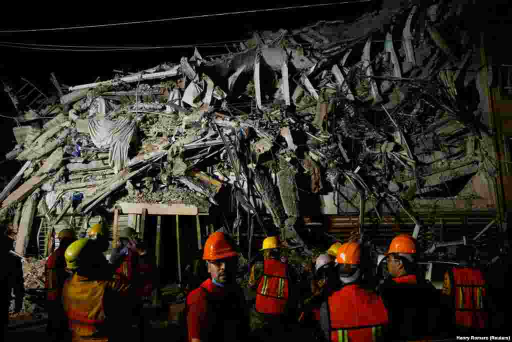 MEXICO -- Rescuers work at a the site of a collapsed building after an earthquake in Mexico City, Mexico September 20, 2017