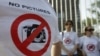 Demonstrators gather outside Georgia's presidential palace in Tbilisi in July 2011 to protest a notorious 2011 case in which the government used secret materials to accuse three Georgian journalists of spying for Russia.