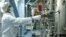 A worker adjusts machinery at a uranium-conversion plant in Isfahan, Iran. 