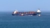 Cargo ships and tankers sail in the the Gulf of Oman late last month. 