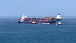 Cargo ships and tankers sail in the the Gulf of Oman late last month. 