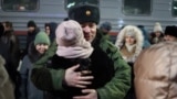 A mobilized Russian soldier in the Tyumen region says goodbye to his loved ones as he departs for the war in Ukraine. (file photo)