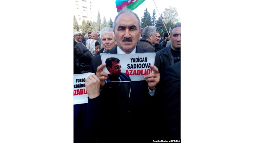 A protester urges the release of activist Yadigar Sadiqov, who is serving a six-year prison sentence.