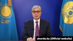 Kazakh interim President Qasym-Zhomart Toqaev speaks during a televised address to the nation to call a snap presidential election in Nur-Sultan on April 9. 