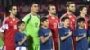 Armenian football players sing their national anthem before a Euro 2016 qualifying match against Albania in Yerevan in October 2015.