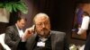 FILE - In this Jan. 29, 2011, file photo, Saudi Arabian journalist Jamal Khashoggi speaks on his cellphone at the World Economic Forum in Davos, Switzerland. The Washington Post said Wednesday, Oct. 3, 2018, it was concerned for the safety of Khashoggi, a