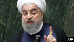 "I see it as unlikely that the IAEA will accept the request for inspections, but even if they do, we will not," Iranian President Hassan Rohani said. (file photo)