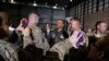 Soldiers take photos as U.S. President Barack Obama (center) shakes hands with troops after delivering remarks at Bagram Air Base near Kabul on May 25.