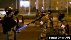 Riot police flooded Minsk during mass protest following the contested presidential last August. 