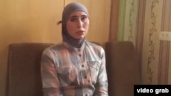 Amina Okuyeva and her husband were traveling in a car on the outskirts of the Ukrainian capital on October 30 when a vehicle began chasing them.