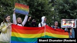 LGBT activists protest against amendments to the constitution in Moscow in July 2020. The placard says, "I don't recognize the authority that keeps me from having a family."