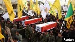 A funeral for members of the Popular Mobilization Forces, an Iranian proxy force in Iraq, on April 2, following air strikes west of Mosul last week.