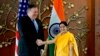 U.S. Secretary of State Mike Pompeo, left, shakes hand with Indian Foreign Minister Sushma Swaraj before a meeting in New Delhi, India, Thursday, Sept. 6, 2018. Pompeo and Defense Secretary James Mattis are holding long-delayed talks Thursday with top Ind