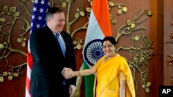 U.S. Secretary of State Mike Pompeo shakes hand with Indian Foreign Minister Sushma Swarah before a meeting in New Delhi on September 6.