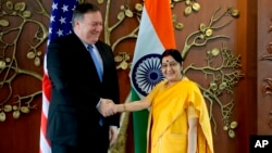 U.S. Secretary of State Mike Pompeo shakes hand with Indian Foreign Minister Sushma Swarah before a meeting in New Delhi on September 6.