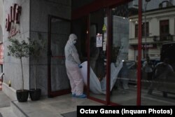 Mansouri's body being carried out of the hotel.