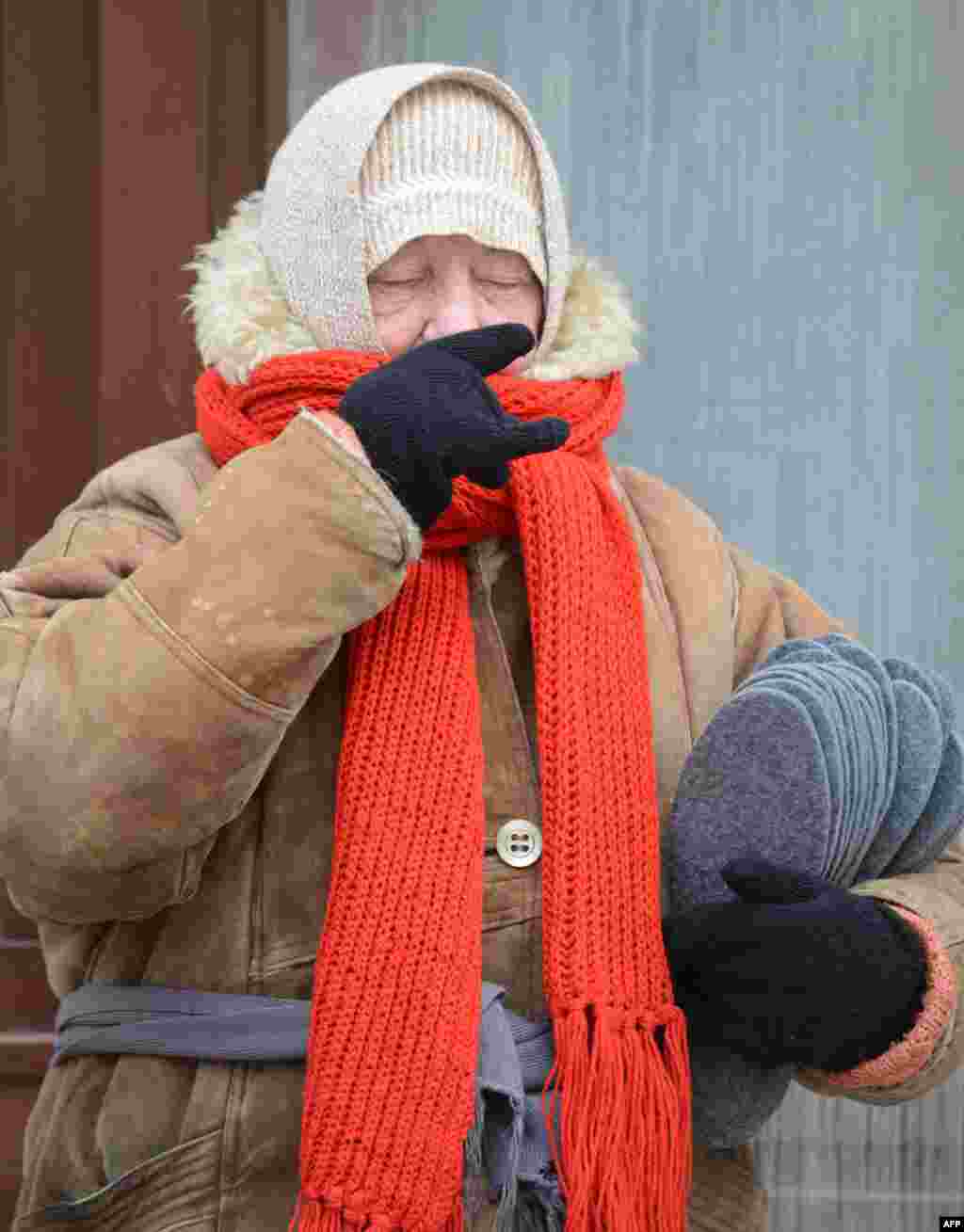 A woman sells felted insoles in the western Ukrainian city of Lviv.