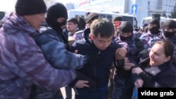 Kazakh police arrest protesters in Astana in 2019.