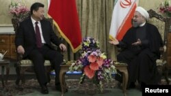 Iranian President Hassan Rohani (right) meets with Chinese President Xi Jinping in Tehran in January 2016.