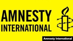 Amnesty International ұйымының логотипі. Көрнекі сурет.