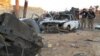 Members of the Iraqi security forces point at destruction in the rural Husayba al-Sharkiya area, east of the Anbar Province capital of Ramadi, as they undertake military operations to attack Islamic State (IS) group positions on December 20.