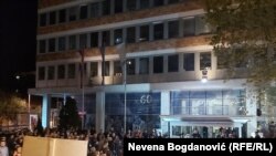 Supporters of the 1 in 5 Million movement that opposes Serbian President Aleksandar Vucic wait for him outside the state television building in Belgrade on November 5.