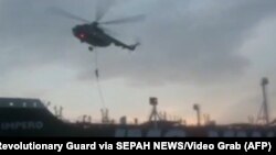 This image grab taken from a video provided by Iran's Revolutionary Guard official website SEPAH News on July 20, 2019, allegedly shows Revolutionary Guard Corps boarding the British-flagged tanker Stena Impero in the Strait of Hormuz. 