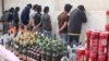 Police arrest a group of men caught in possession of alcoholic beverages in Kerman, Iran. Consuming, producing, or selling alcohol is punishable by prison, floggings, and fines in Iran. 