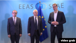 Kosovo Prime Minister Avdullah Hoti (left), EU foreign policy chief Josep Borell (center), and Serbian President Aleksandar Vucic.