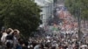 Russia -- Participants march with flags and placards during an anti-government protest in Moscow, 12Jun2012