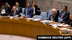 Russia Ambassador to the United Nations Vitaly Churkin votes against a draft French-Spanish resolution on Syria at UN headquarters in New York on October 8. 