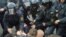 A Belarusian opposition demonstration being broken up by police