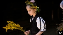 A girl wears a traditional Romanian blouse, known as the "ia." (file photo)