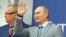 Russian President Vladimir Putin waves to the crowd at the Russian Formula One Grand Prix in Sochi on September 30.