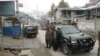 FILE: Army officials stand guard near the site of a suicide bomb blast targeting members of an anti-Taliban militia in Upper Dir.