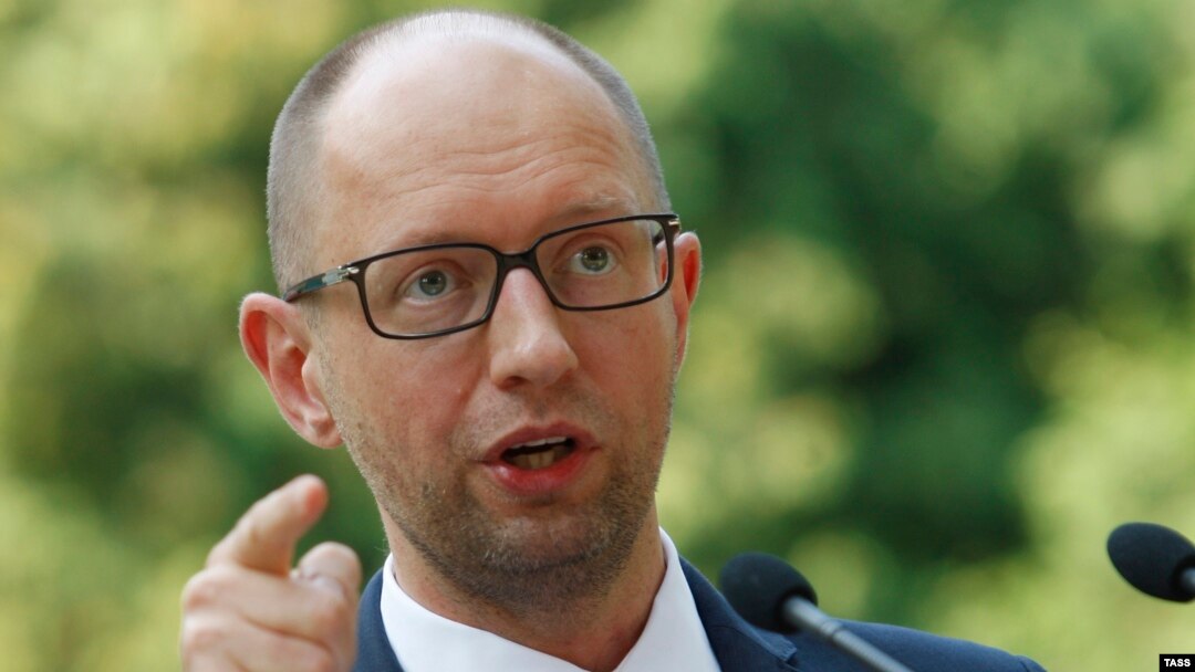 Ukrainian Prime Minister Arseny Yatsenyuk talks to reporters in Kyiv on August 8 about sanctions proposed by the Cabinet against "individuals and legal entities financing terrorism and supporting the occupation of Crimea."