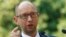 Ukrainian Prime Minister Arseny Yatsenyuk talks to reporters in Kyiv on August 8 about sanctions proposed by the Cabinet against "individuals and legal entities financing terrorism and supporting the occupation of Crimea."