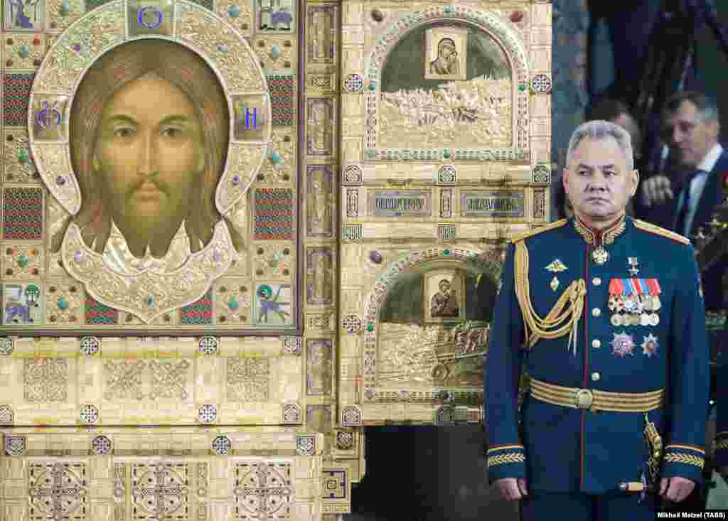 Russian Defense Minister Shoigu attends the ceremony at the cathedral.