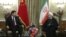 Iranian President Hassan Rouhani (R) meets with Chinese President Xi Jinping in Tehran on January 23, 