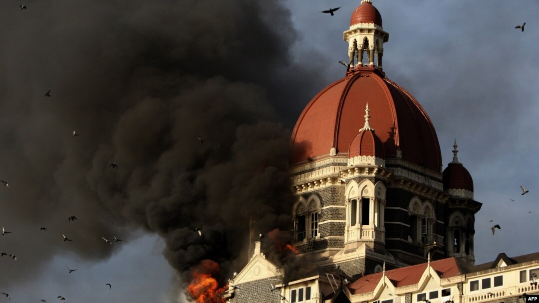 Flames gush out of The Taj Mahal Hotel in Mumbai during the 2008 siege. 