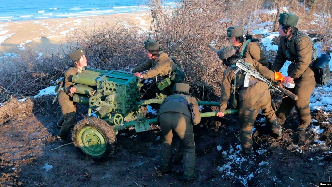 Female soldiers of the North's Korean People's Army take part in landing and defense drills on March 25.