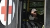 A man sits aboard an evacuation bus before its departure from the city of Pokrovsk on September 20.