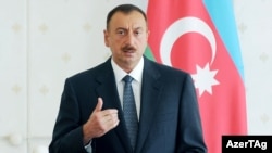 Azerbaijani President Ilham Aliyev presides over a cabinet meeting in Baku on July 12.