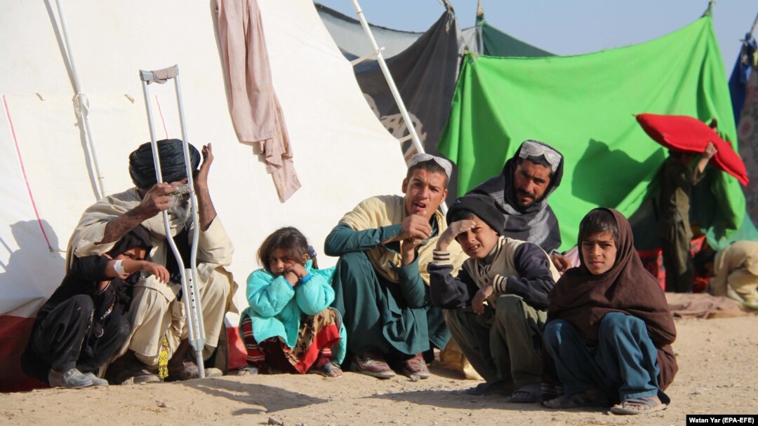Families who fled their villages after the Taliban launched massive attacks in different districts of Helmand Province live in temporary shelters in the provincial capital of Lashkar Gah on November 24.